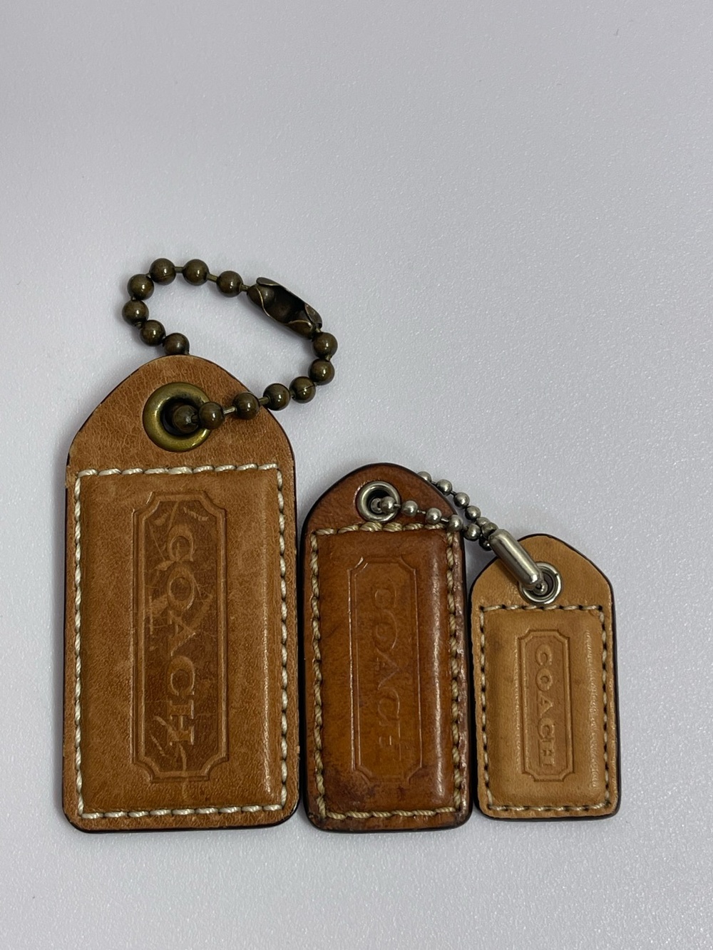 Coach Leather Hangtags Trio in Brown Tones